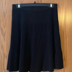 Above the knee winter black skirt. Heavy sweater material.